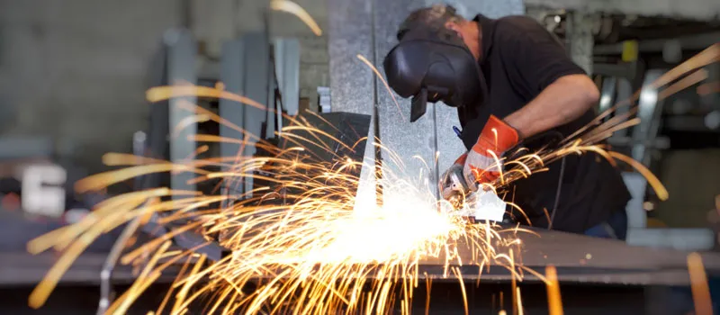 Worker welding at a manufacturing  factory