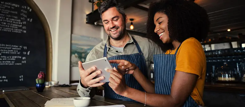 Cafe owners applying for business finance to grow their cafe